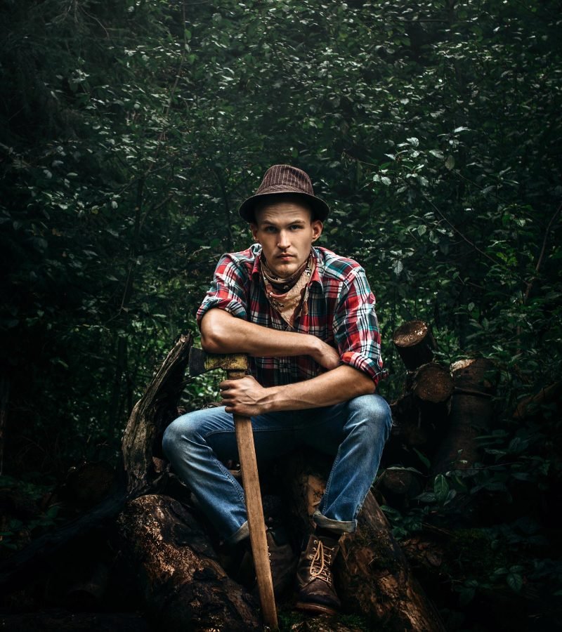 stylish-hipster-lumberjack-with-ax-in-the-sunny-fo-68HK3E8-1.jpg